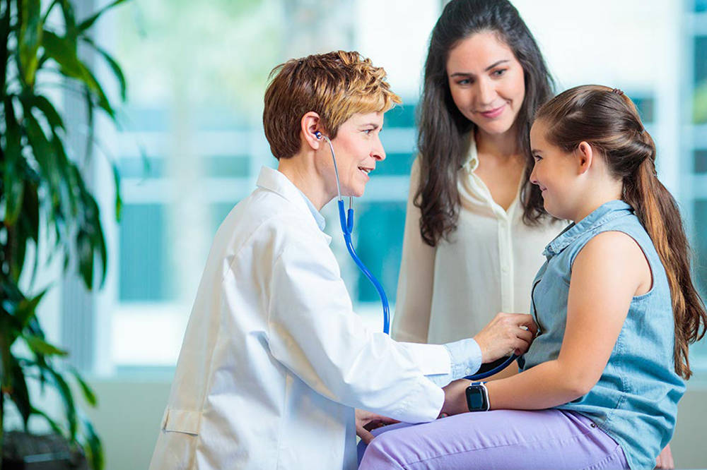 Young Female Patient Looking Optimistic In Hospital Background