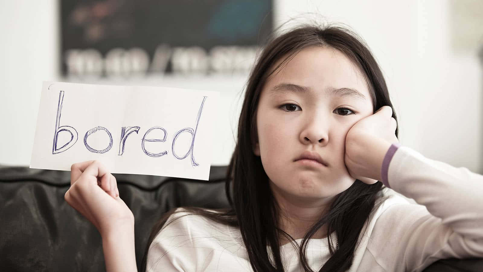 Young Girl Expressing Reluctance And Boredom Background