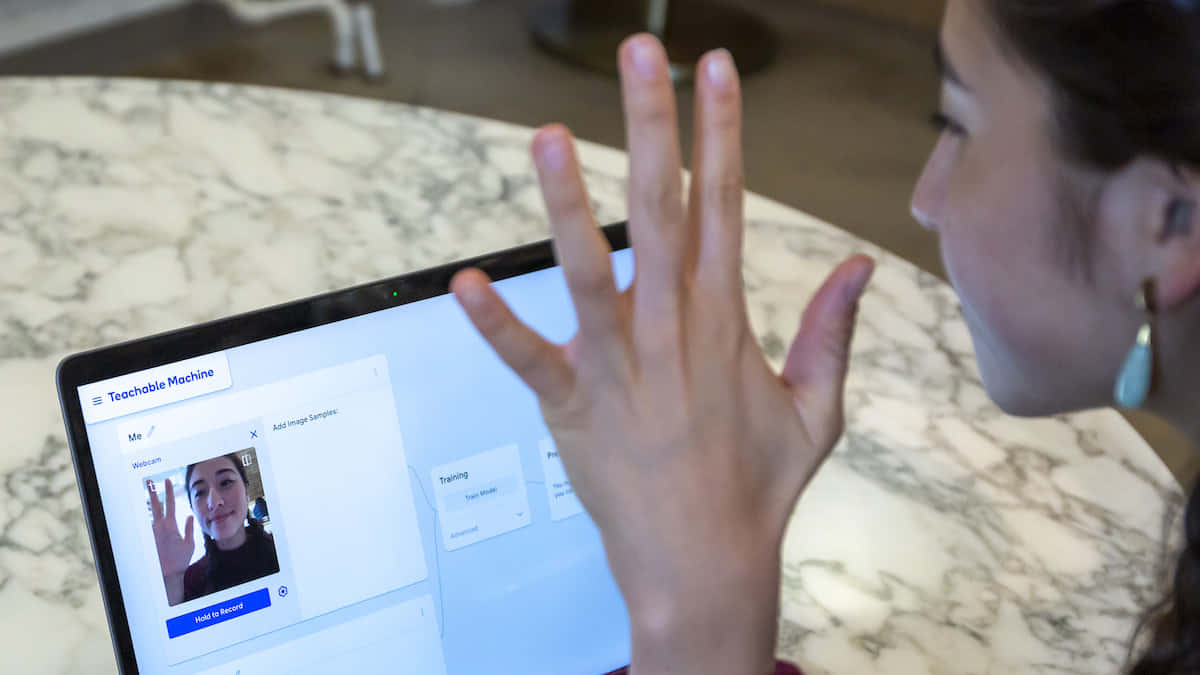 Young Girl Interacting With Teachable Machine