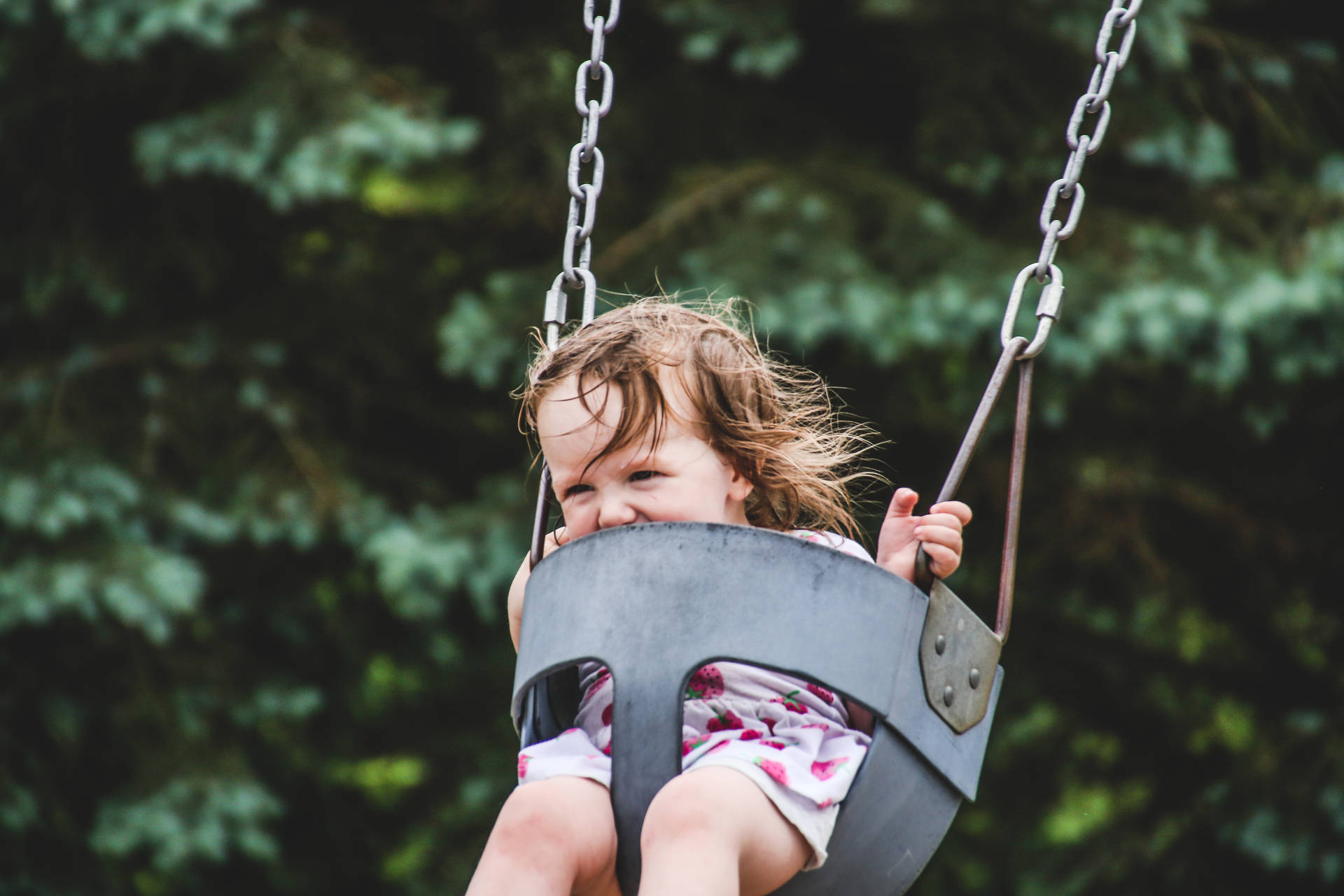 Young Girl On Playground Swing Background