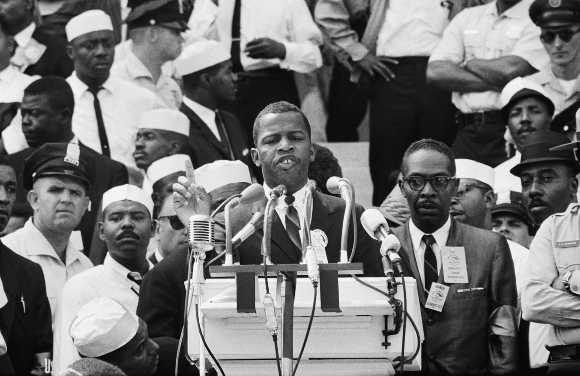 Young John Lewis Making A Speech Background