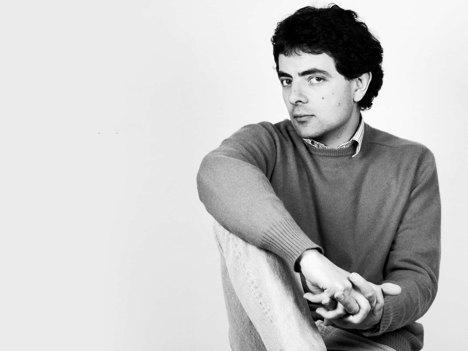 Young Man Contemplative Pose Blackand White Background