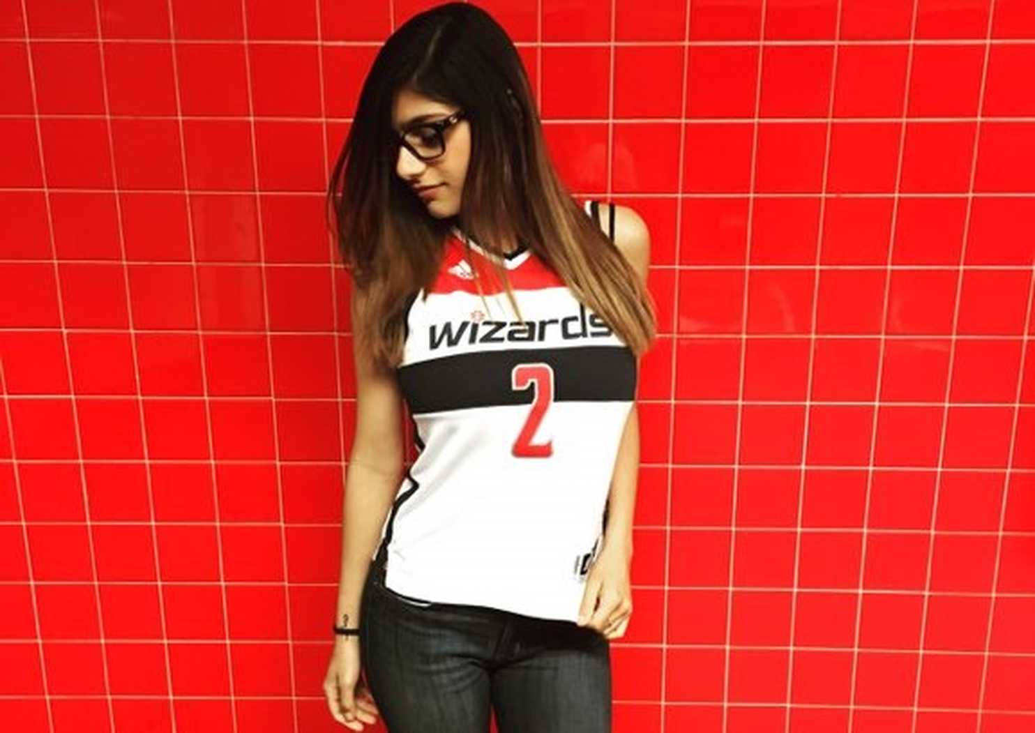 Young Mia Khalifa On Red Tiles Background