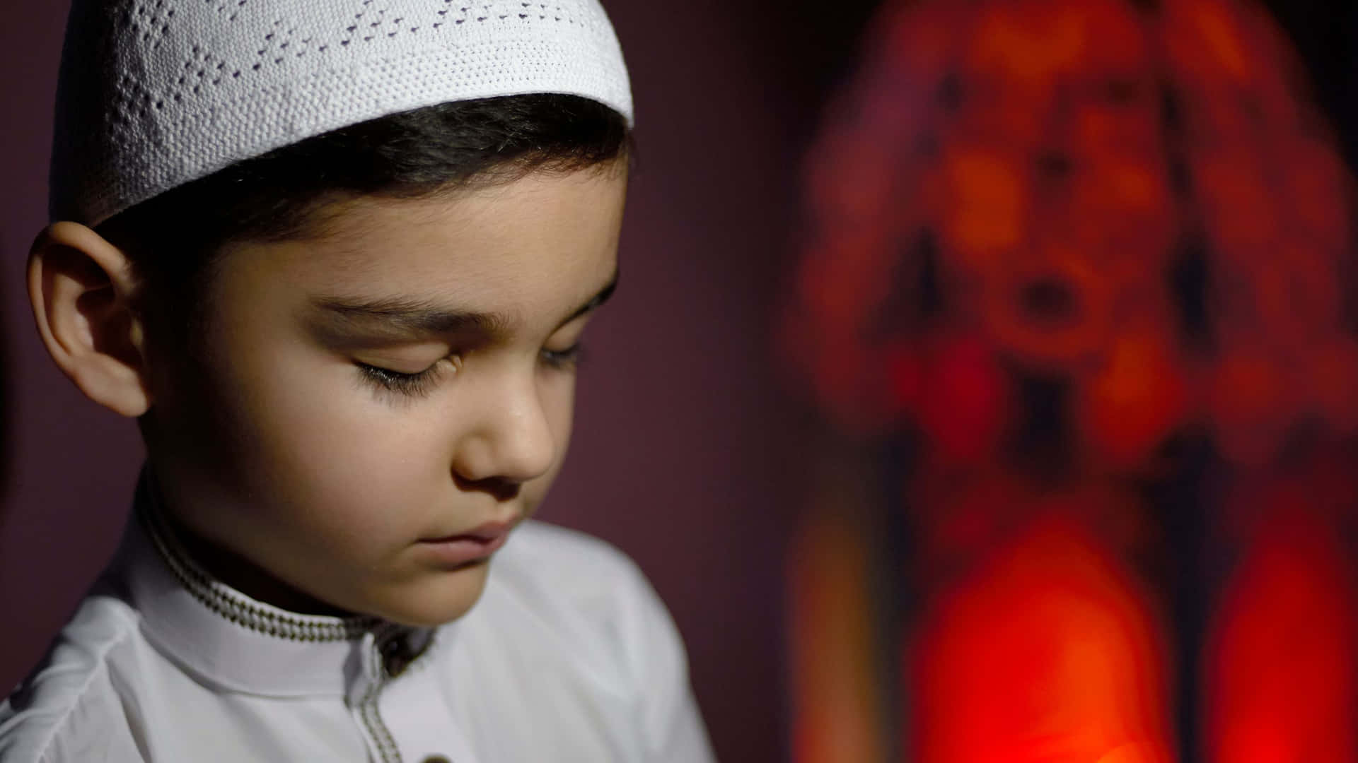 Young Muslim Boy In Prayer Background