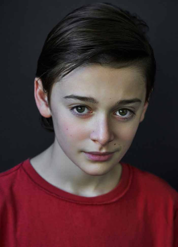 Young Noah Schnapp With Red Shirt Background