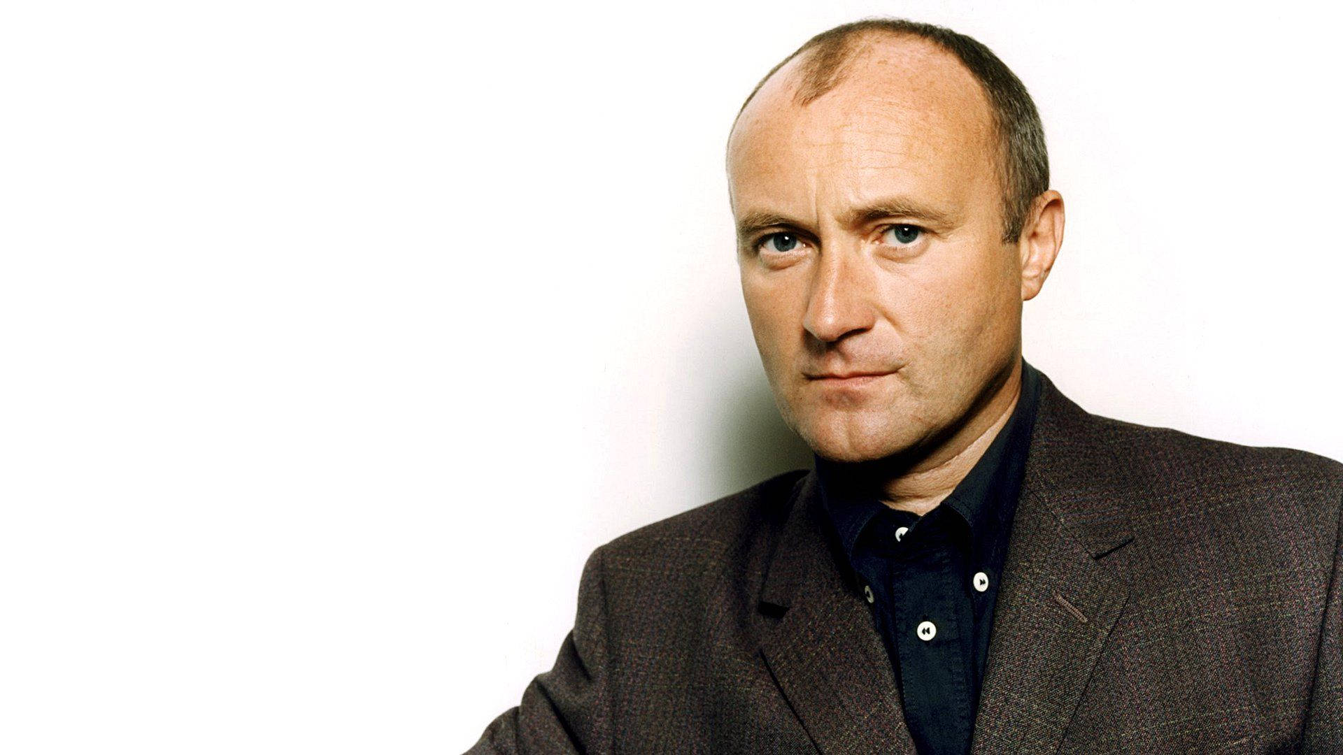 Young Phil Collins Smirking Background