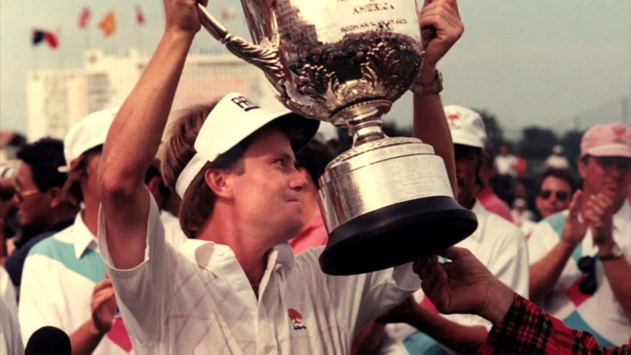 Young Scott Verplank Holding Trophy Up Background