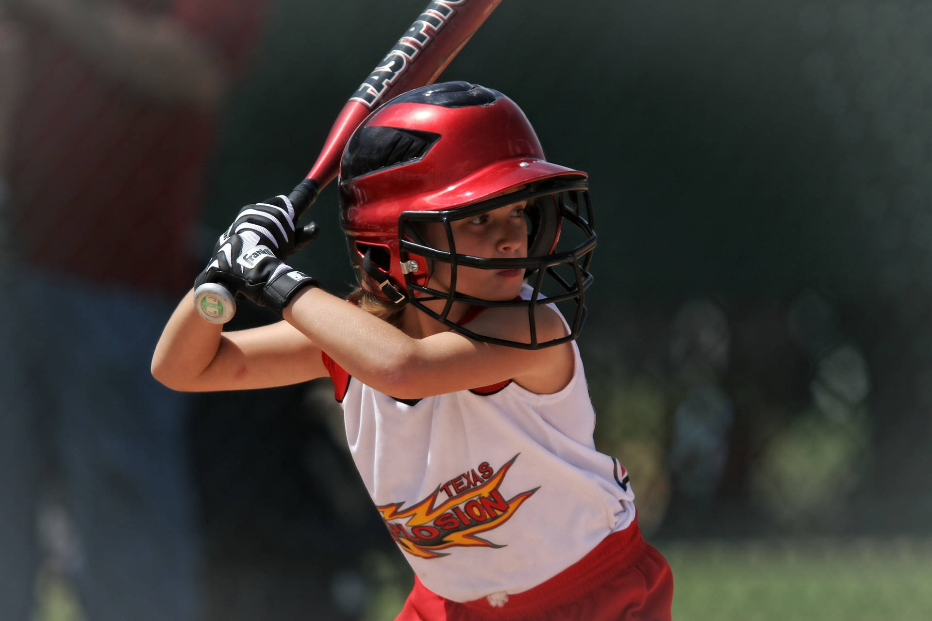 Young Softball Player Holding Bat Background