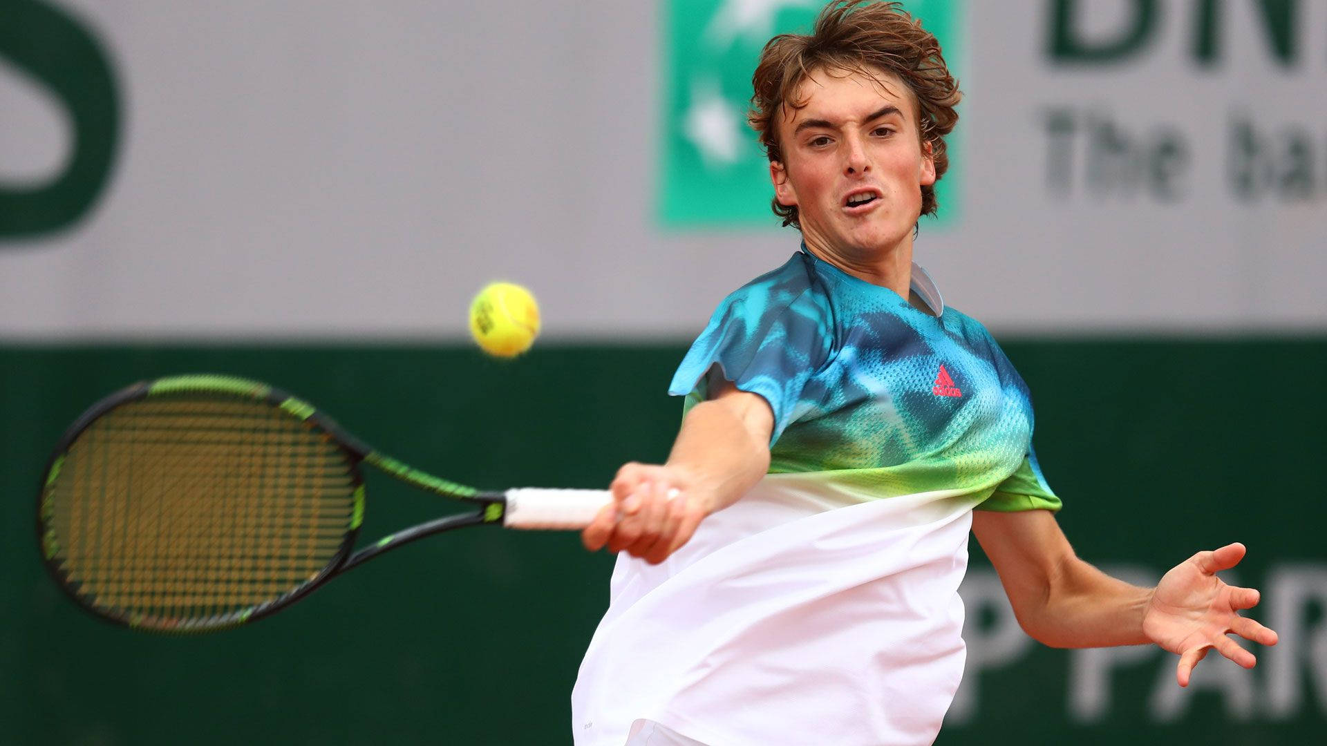 Young Stefanos Tsitsipas Perfecting His Tennis Craft Background