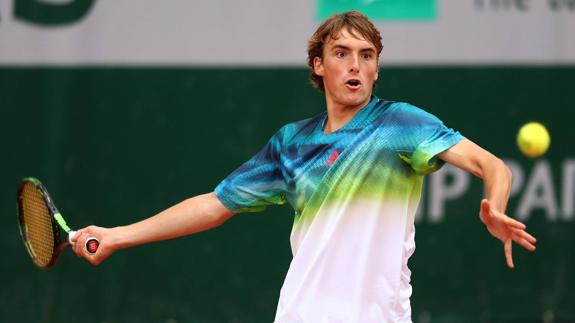 Young Stefanos Tsitsipas With Short Hair Background