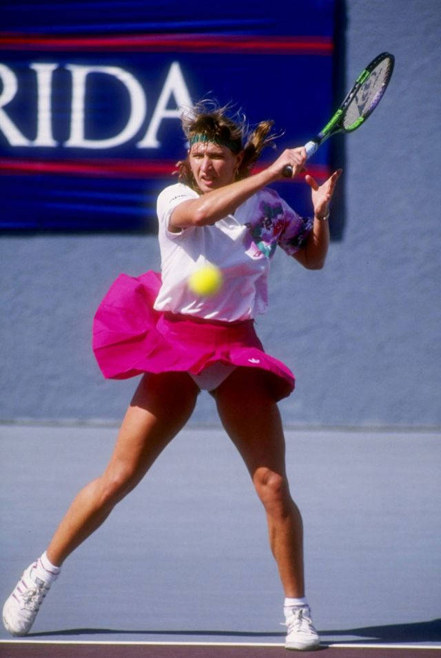 Young Steffi Graf Hitting The Ball Background