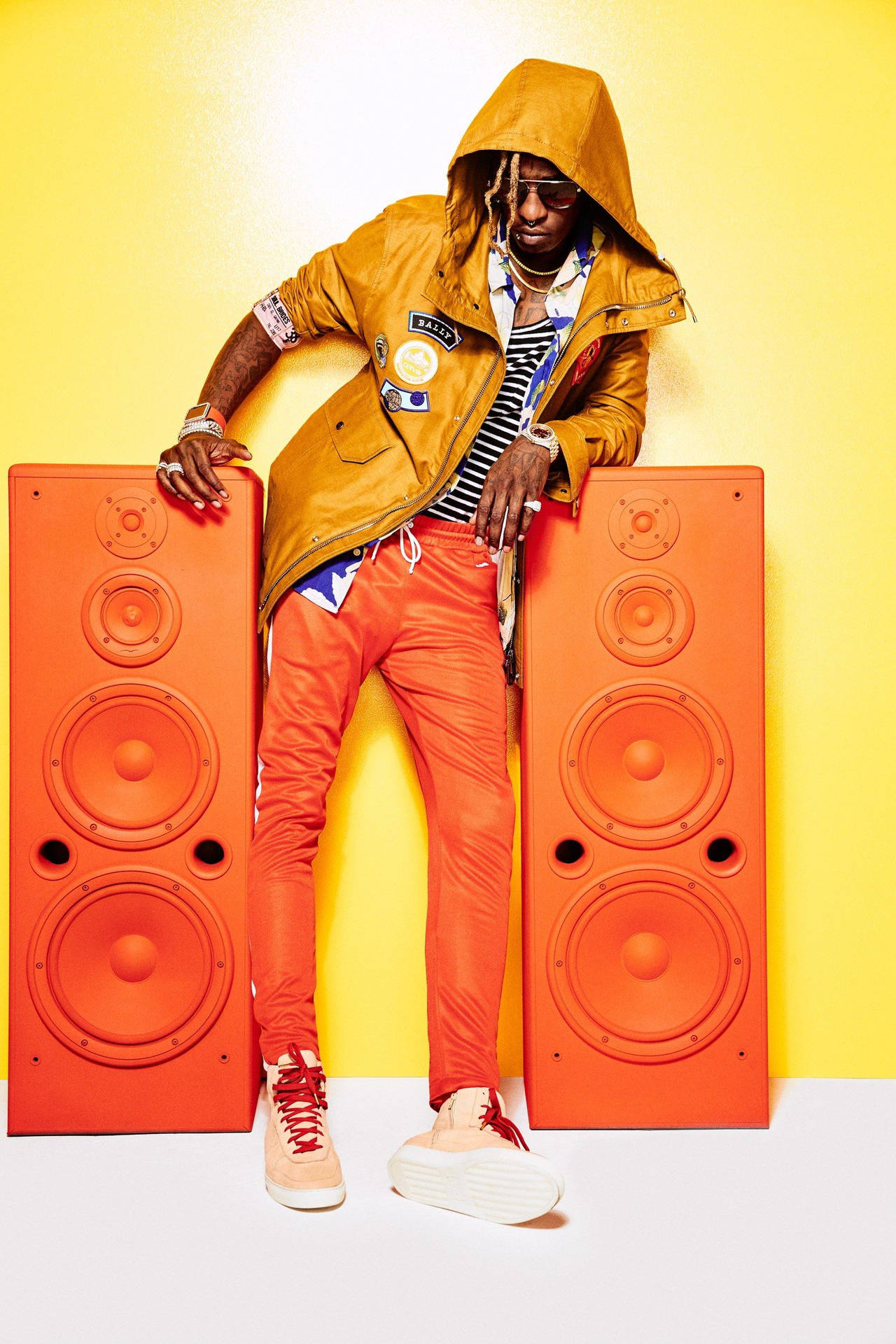 Young Thug Expresses His Eccentricity With An Orange Phone. Background