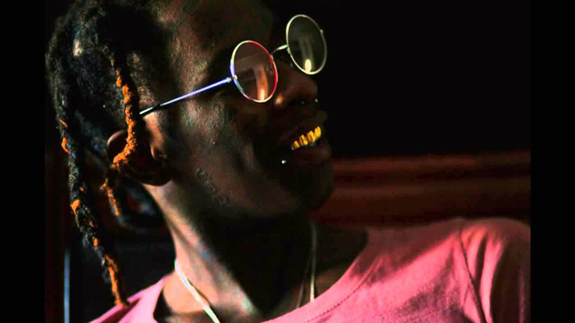 Young Thug Flaunting His Golden Teeth Background