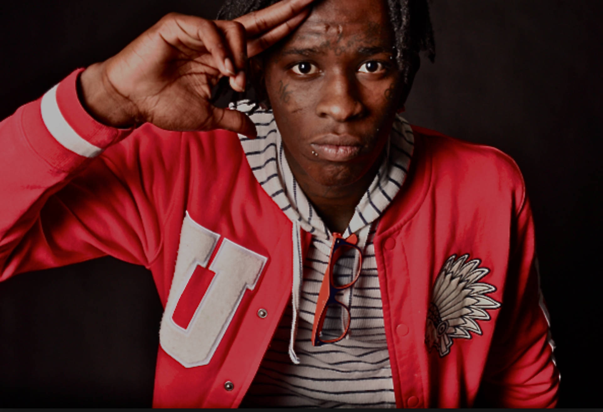 Young Thug In A Red Sleeve Tartan Top. Background