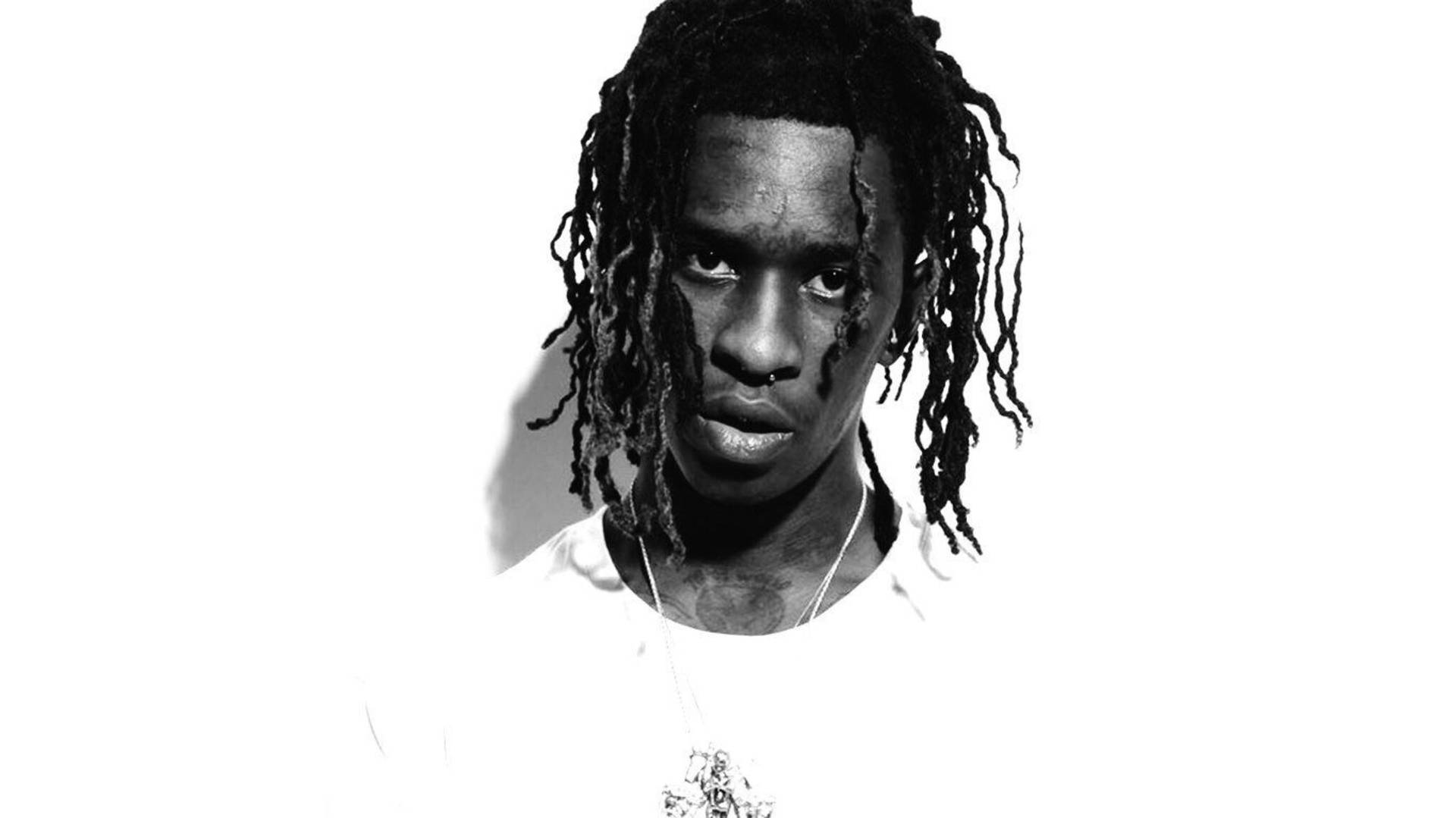 Young Thug Showing Off His Signature Style. Background