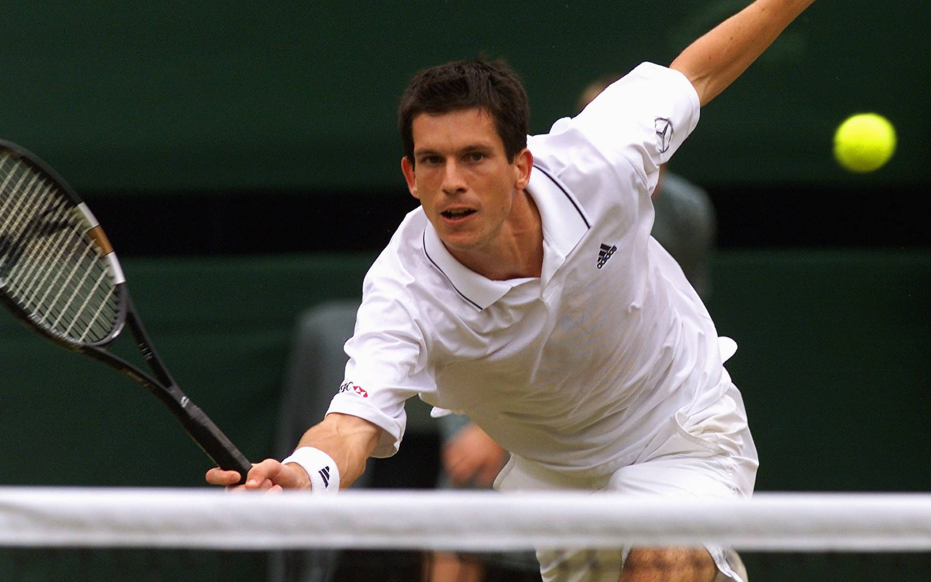 Young Tim Henman Intensively Playing Tennis Background