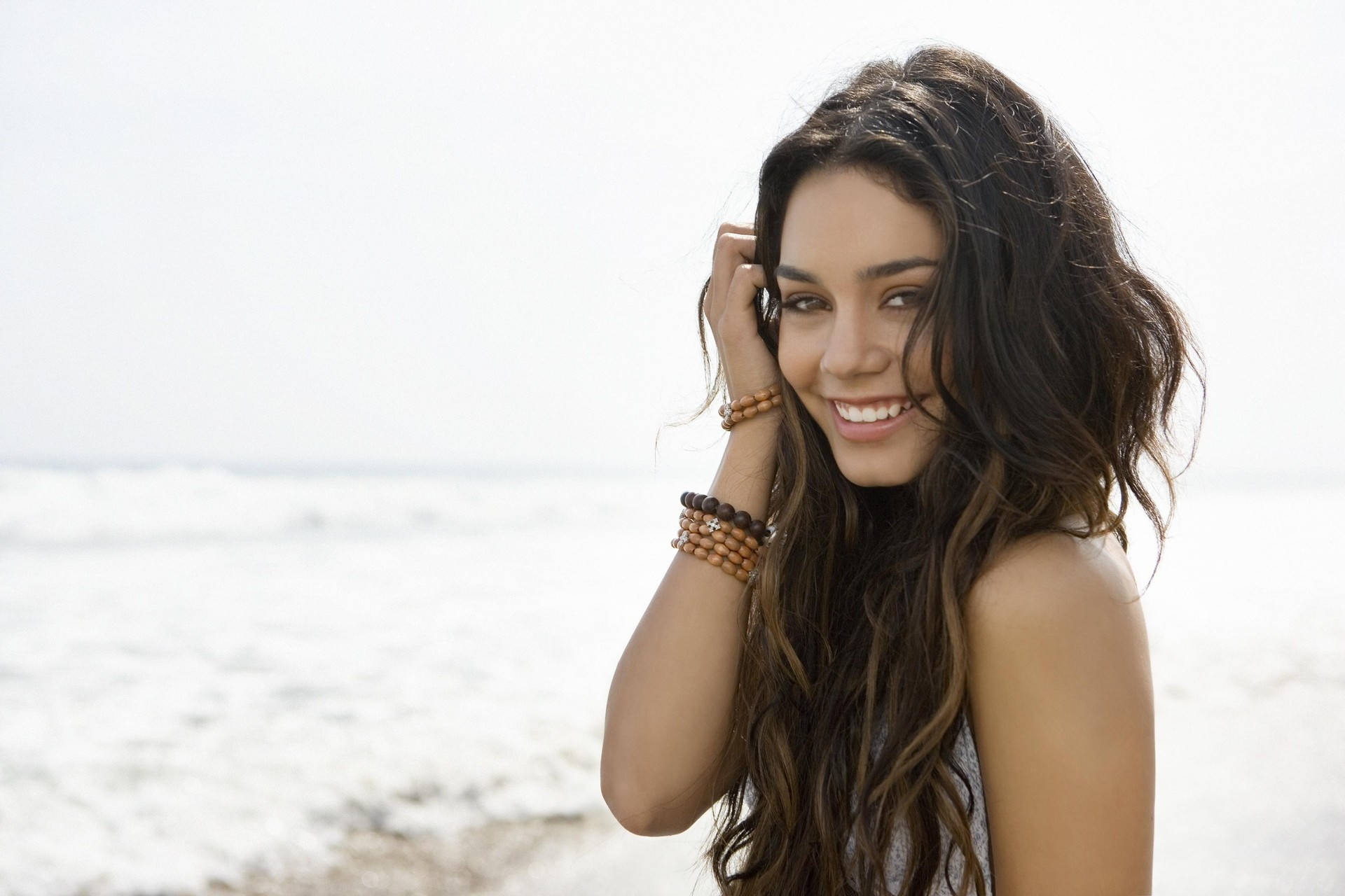 Young Vanessa Hudgens At A Beach Background