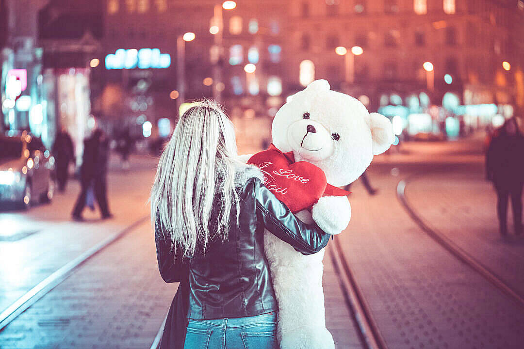 Young Woman With A Cute Teddy Bear Background