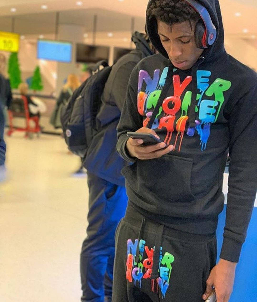 Youngboy Never Broke Again Using Phone Background