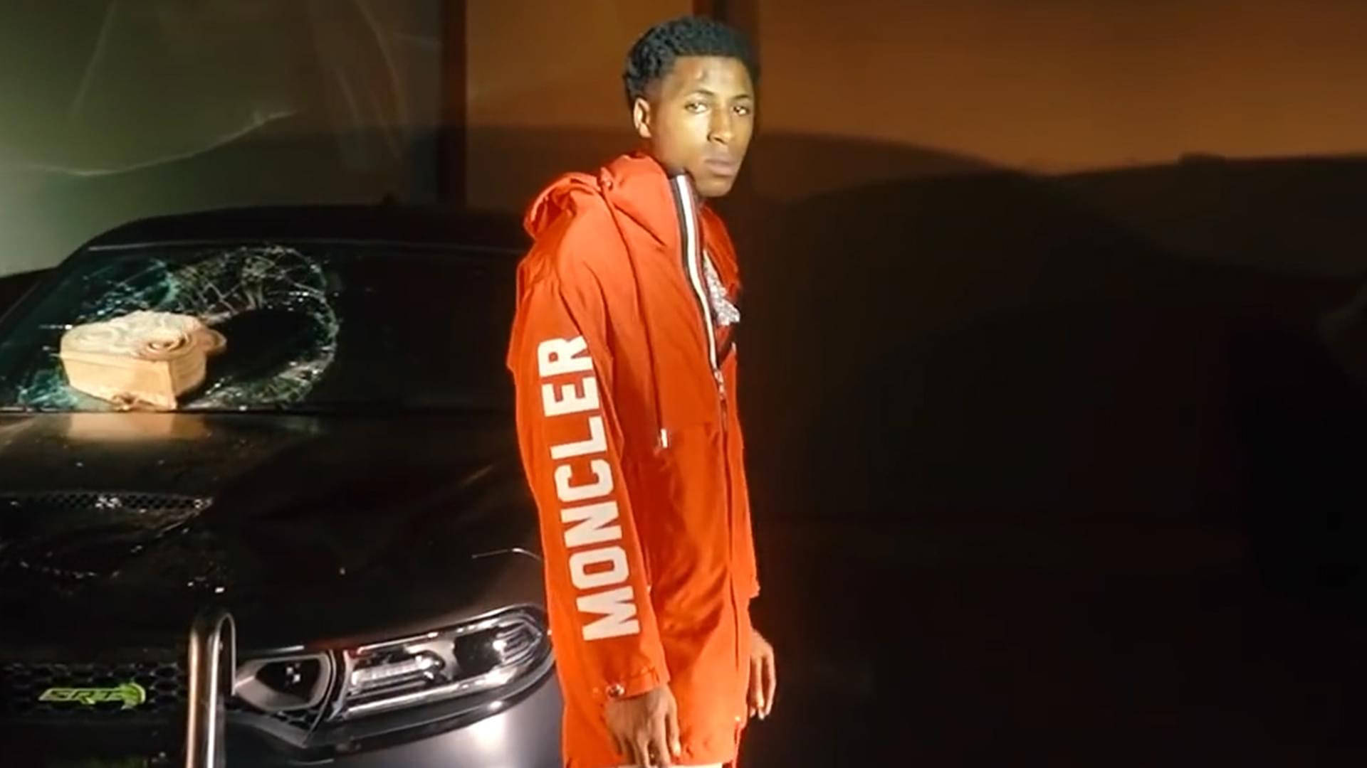 Youngboy Never Broke Again With Orange Jacket Background