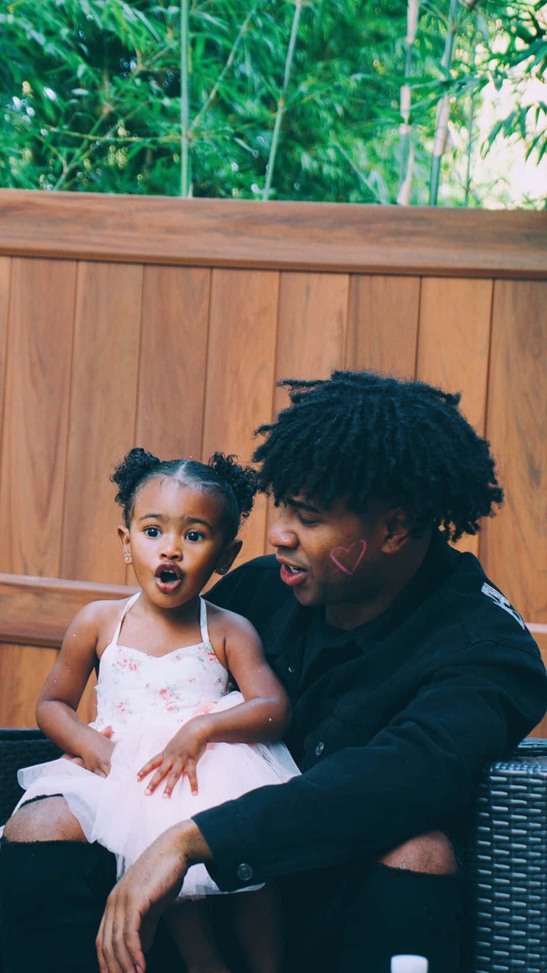 Youtuber Prettyboyfredo With His Daugther Background