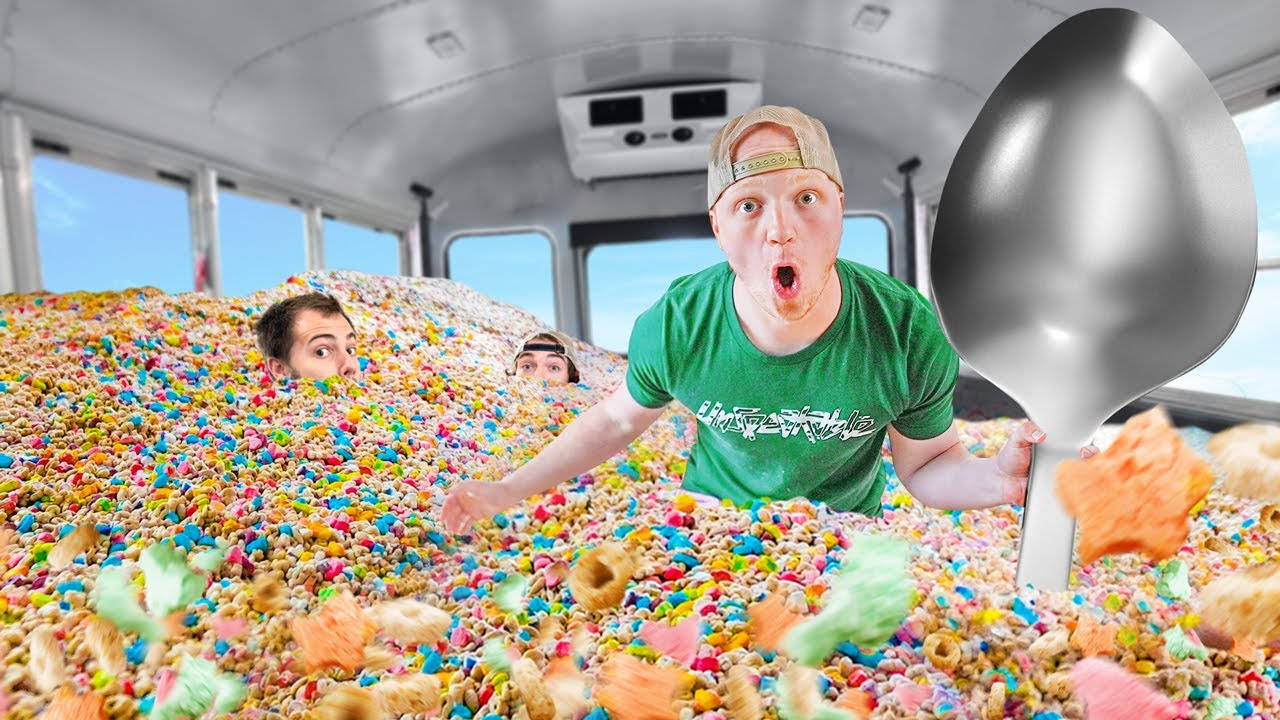 Youtuber Unspeakable's Fun-filled Adventure: Eating Cereal In A School Bus Background