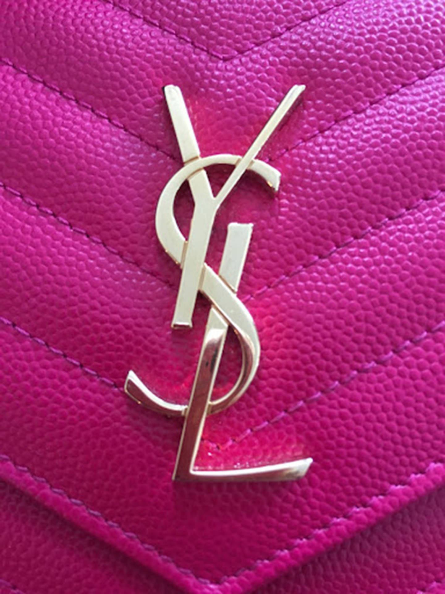Ysl Logo In Pink Purse Background