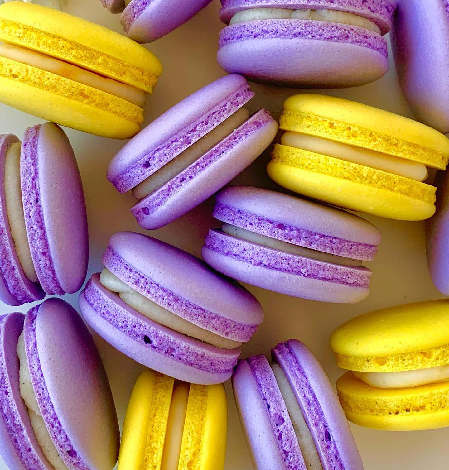 Yummy Yellow And Violet Macaroons Background