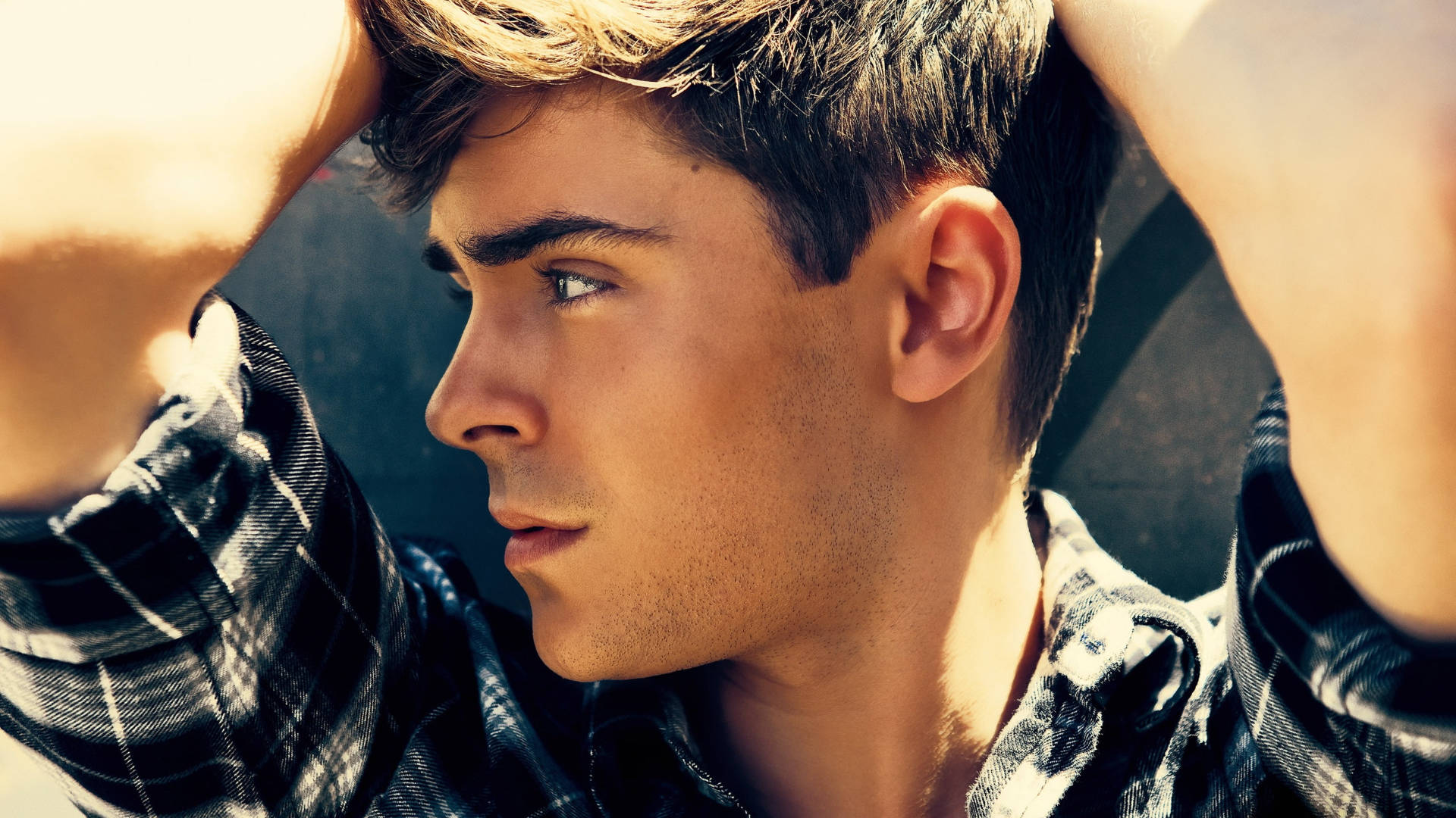 Zac Efron Looking Young And Dashing In A Black T-shirt. Background