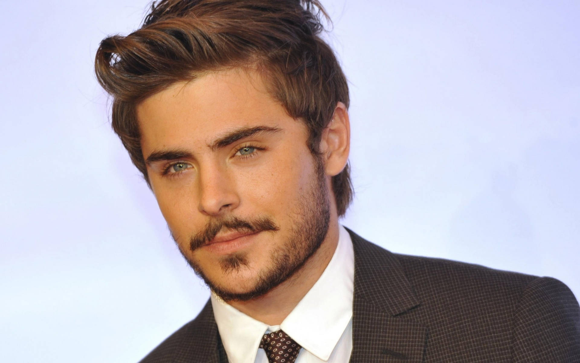 Zac Efron Looks Dapper With A Mustache Background