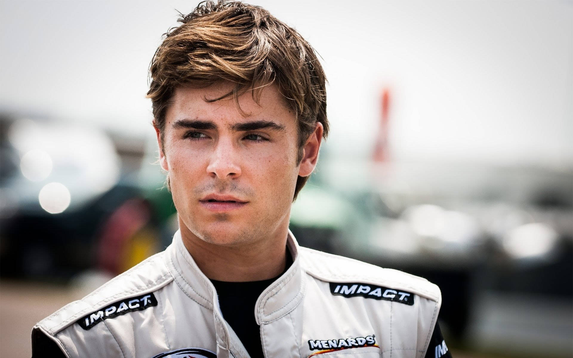 Zac Efron Wearing A Racing Suit