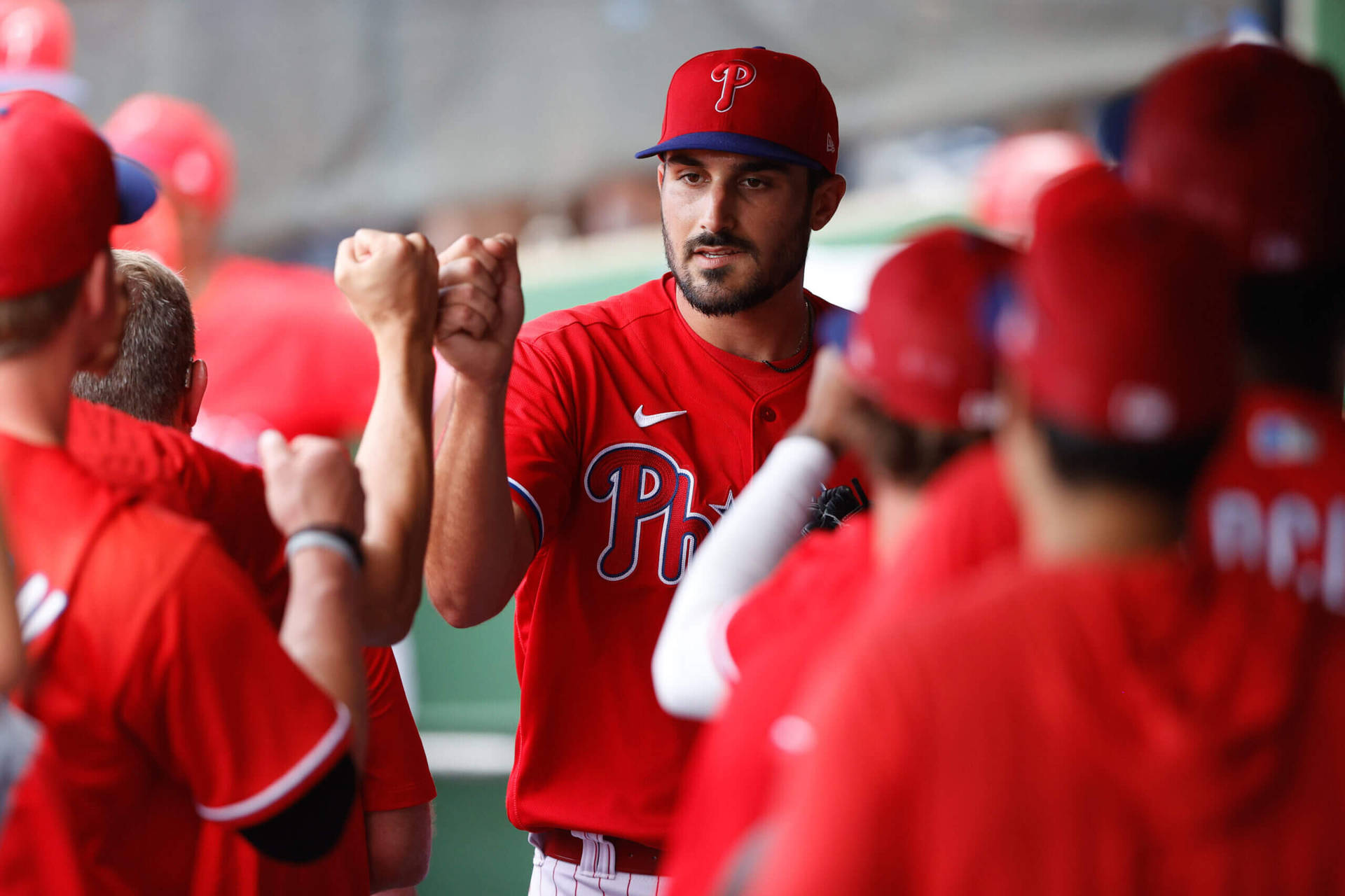 Zach Eflin Fist Bump With Teammates Background