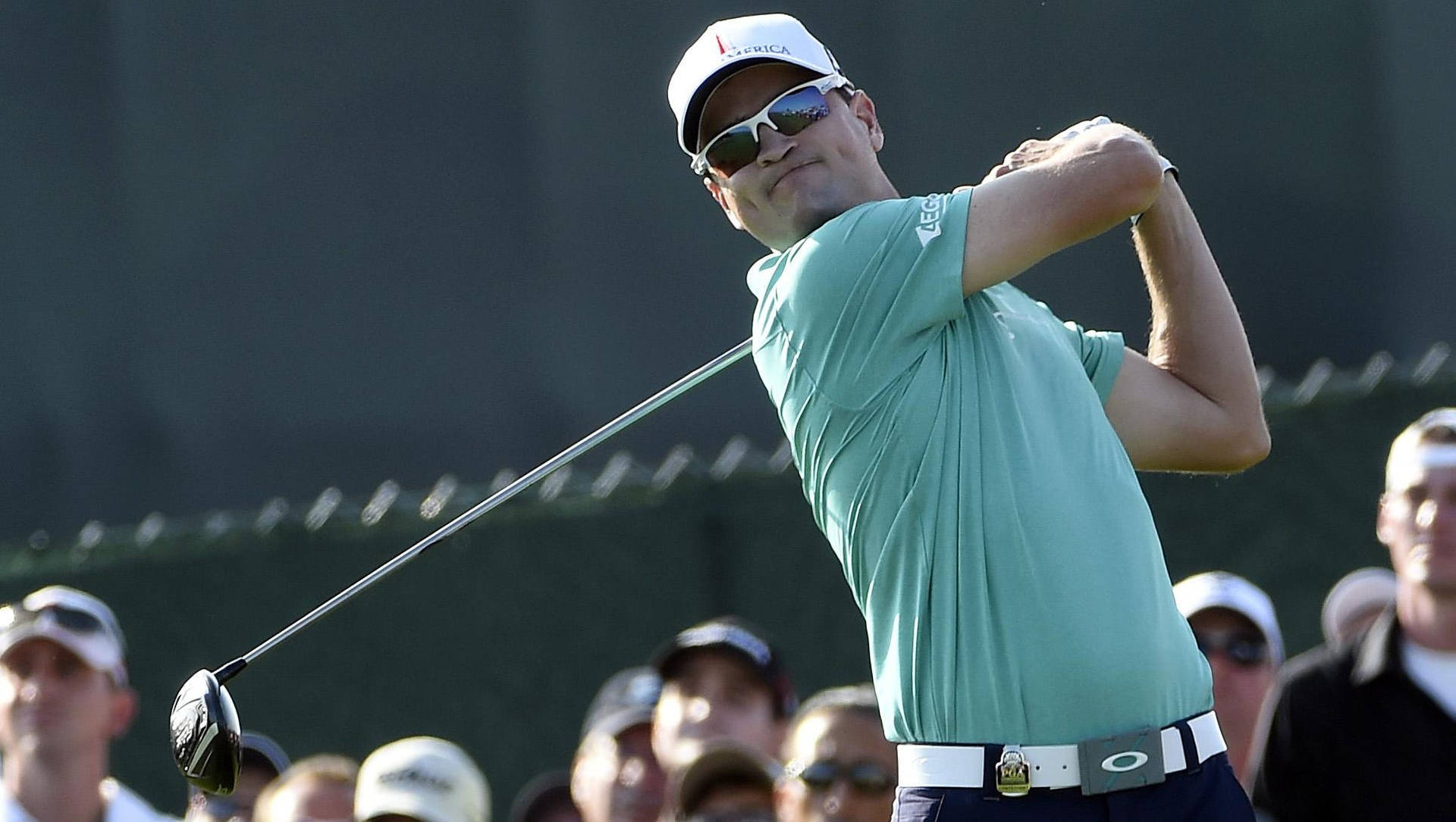 Zach Johnson Swinging A Club Background