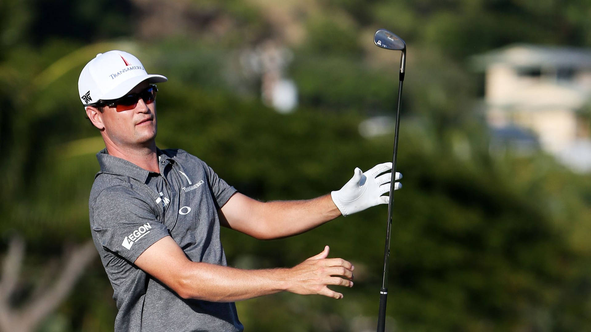 Zach Johnson With A Black Golf Club Background