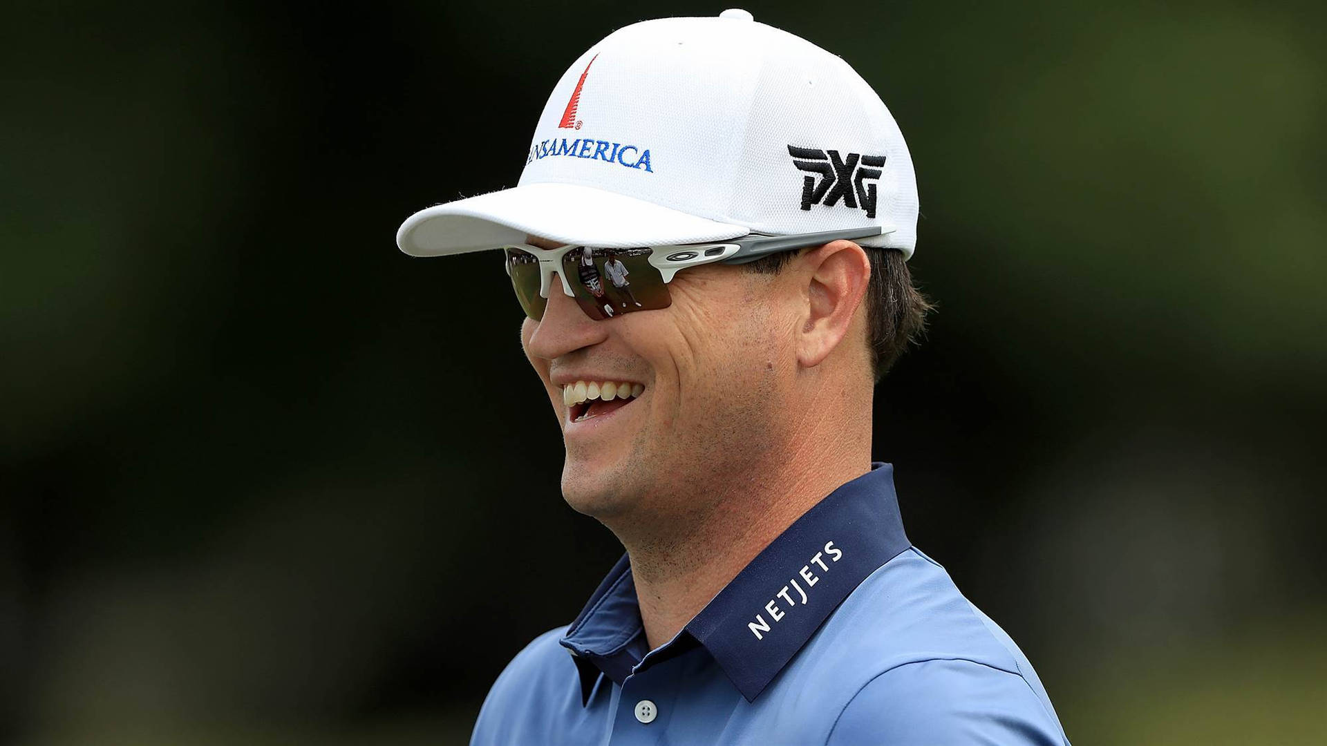 Zach Johnson With A Winning Smile Background