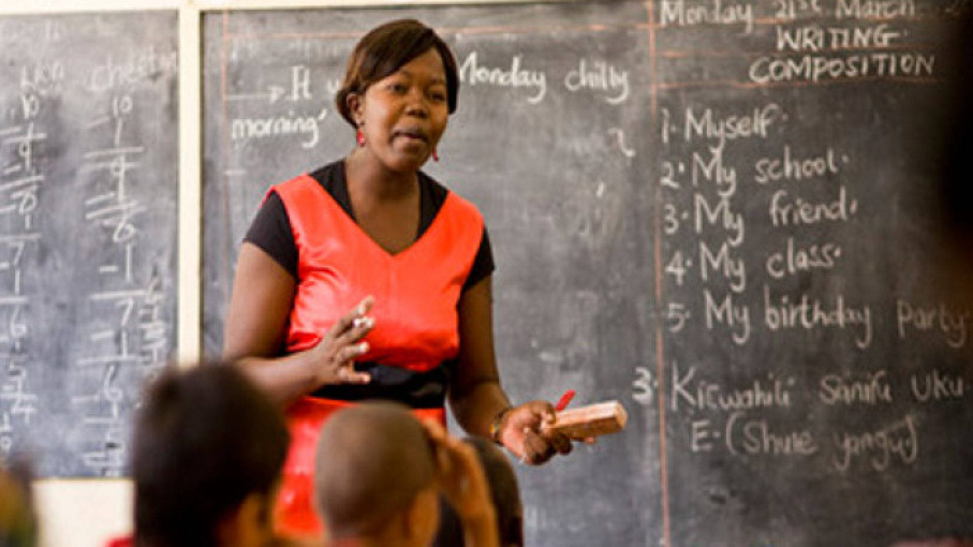 Zambian Teacher Discussing Lesson In Class