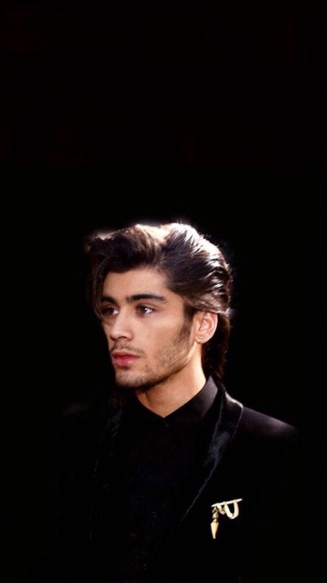 Zayn Malik At The Bbc Music Awards Sporting His Iconic Hairstyle, Captured As An Appealing Iphone Wallpaper. Background