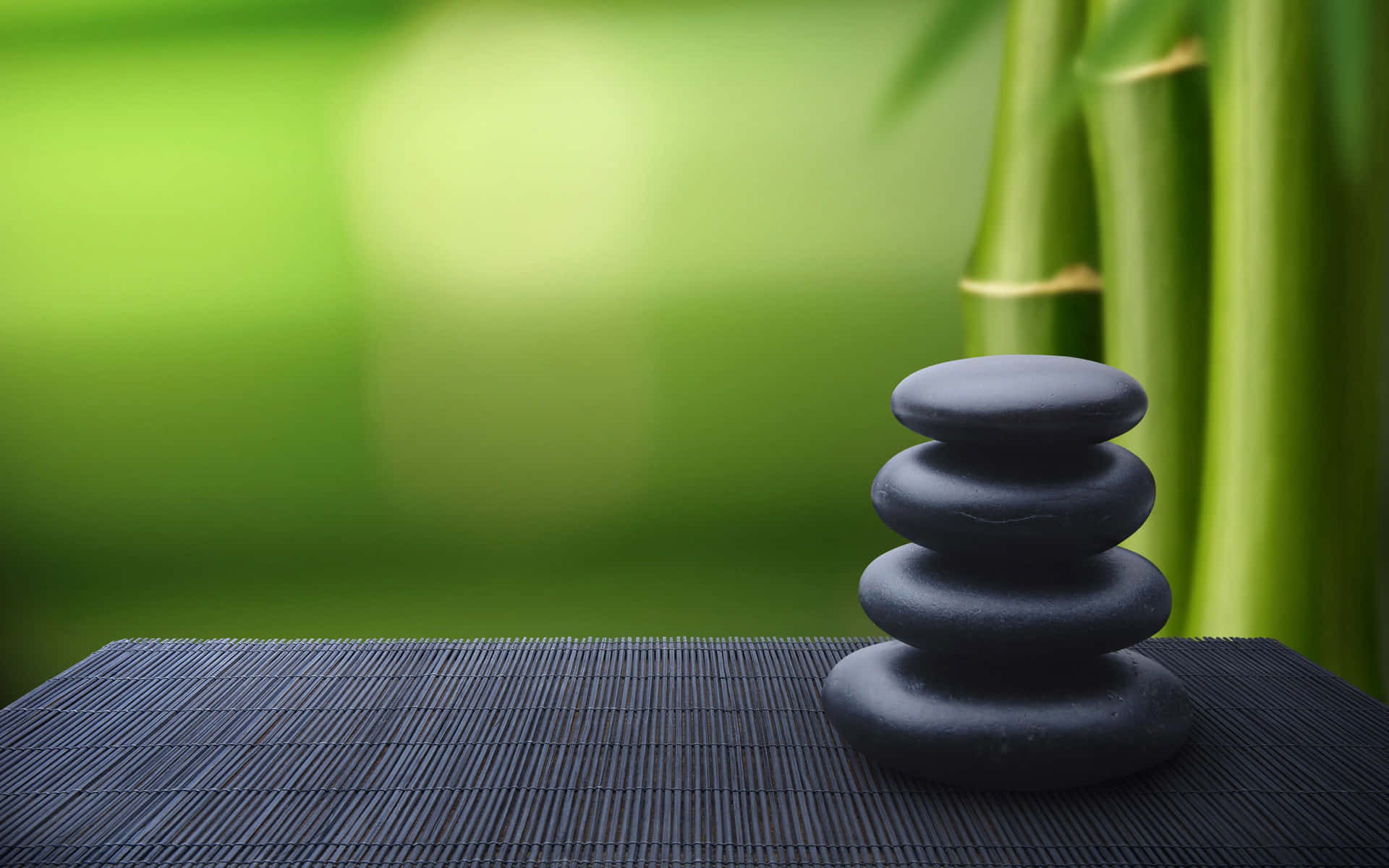 Zen Desktop Black Stone Stack On Top Of Wooden Surface Background
