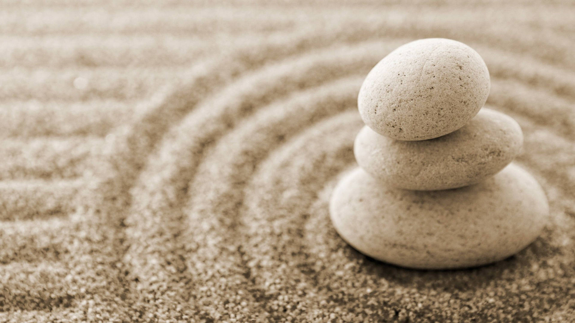 Zen Stones In The Sand Background