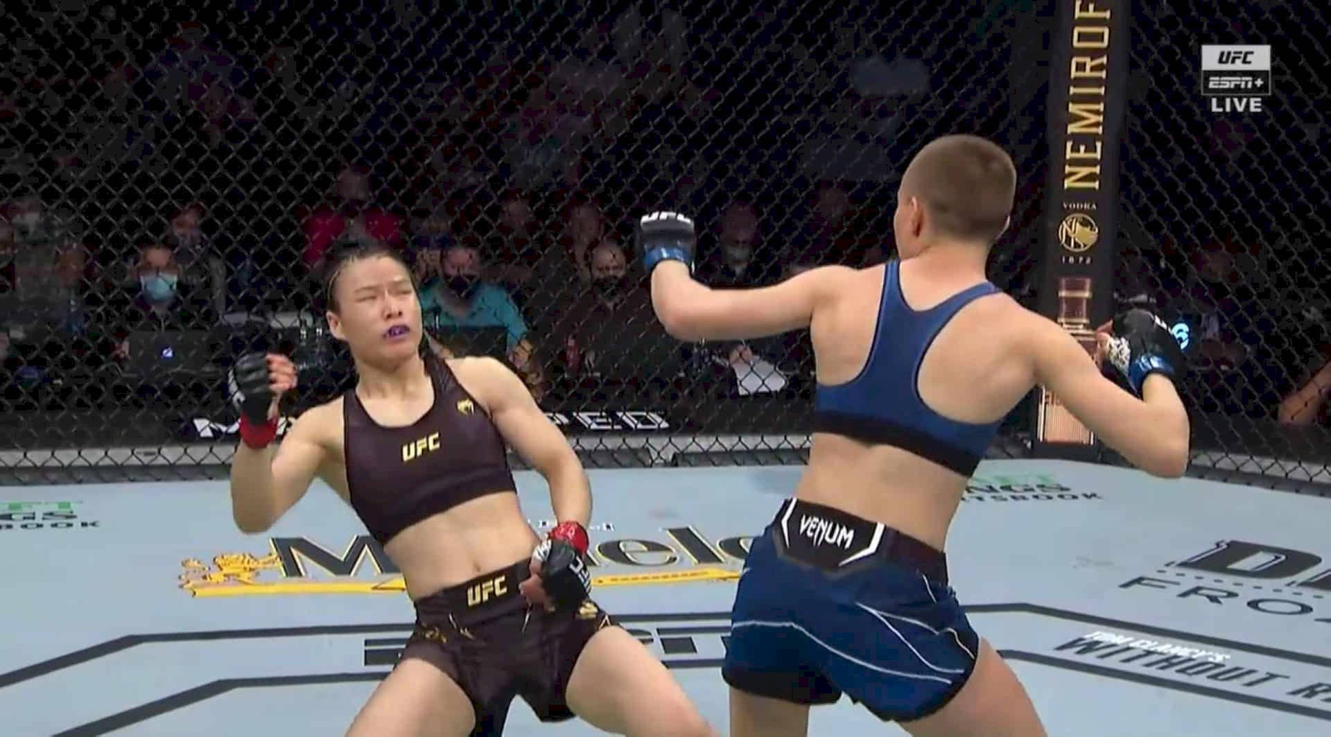 Zhang Weili Avoiding Rose Namajunas Punch Background