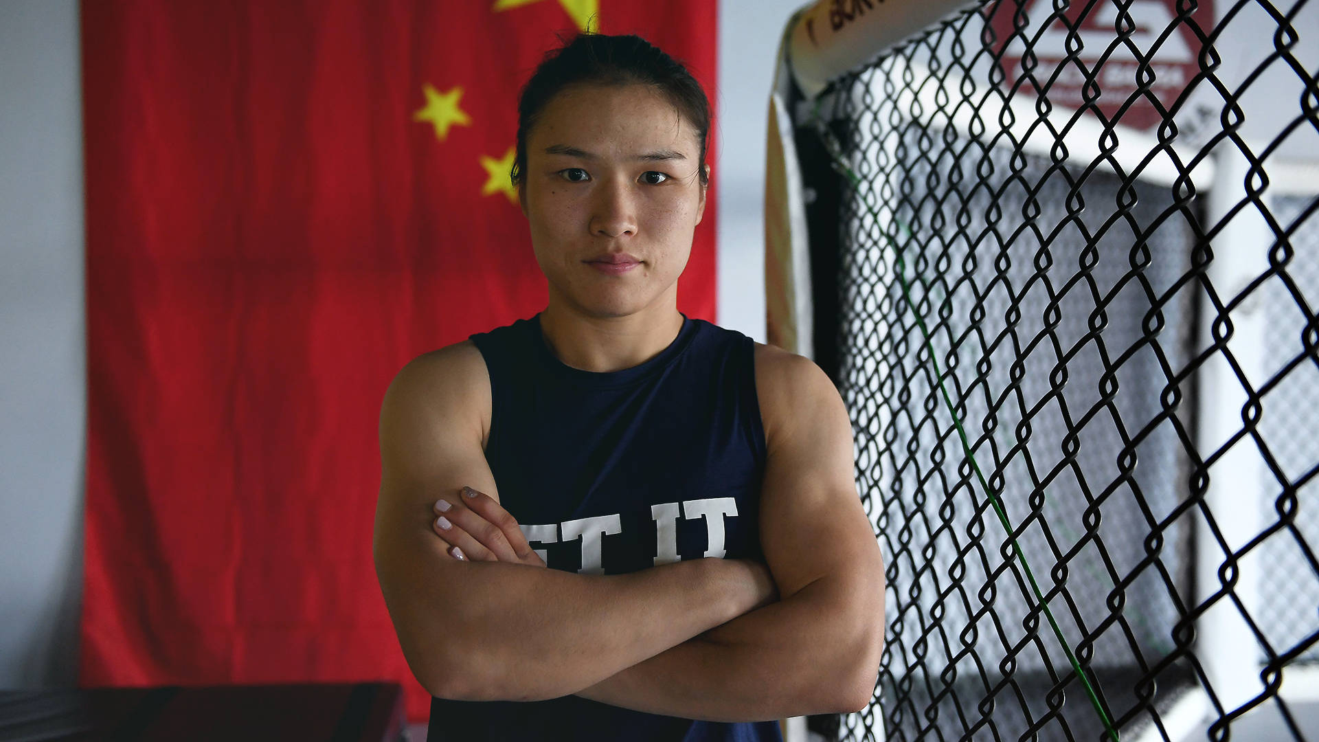 Zhang Weili With Arms Crossed Background