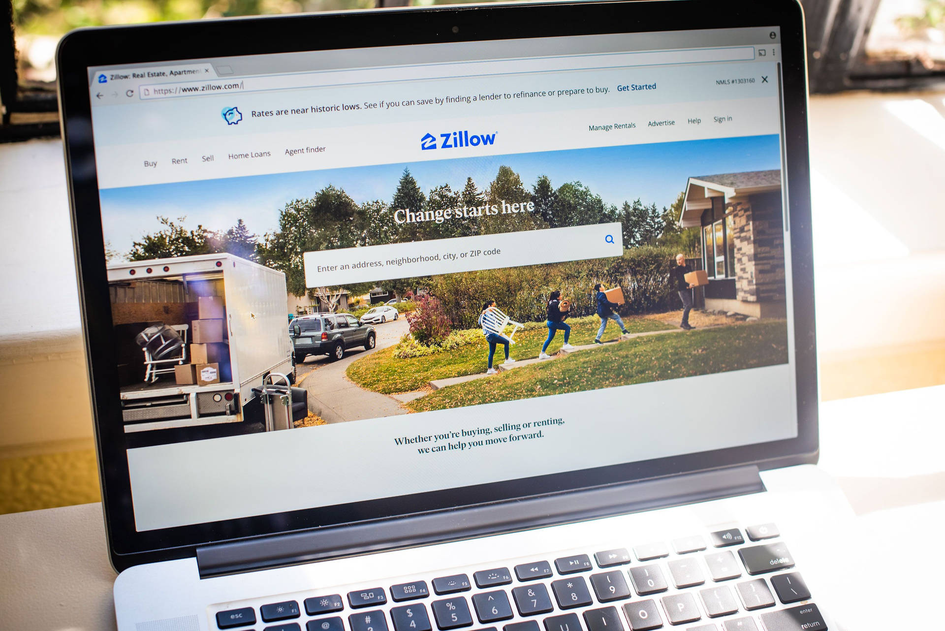 Zillow On Laptop Screen Background