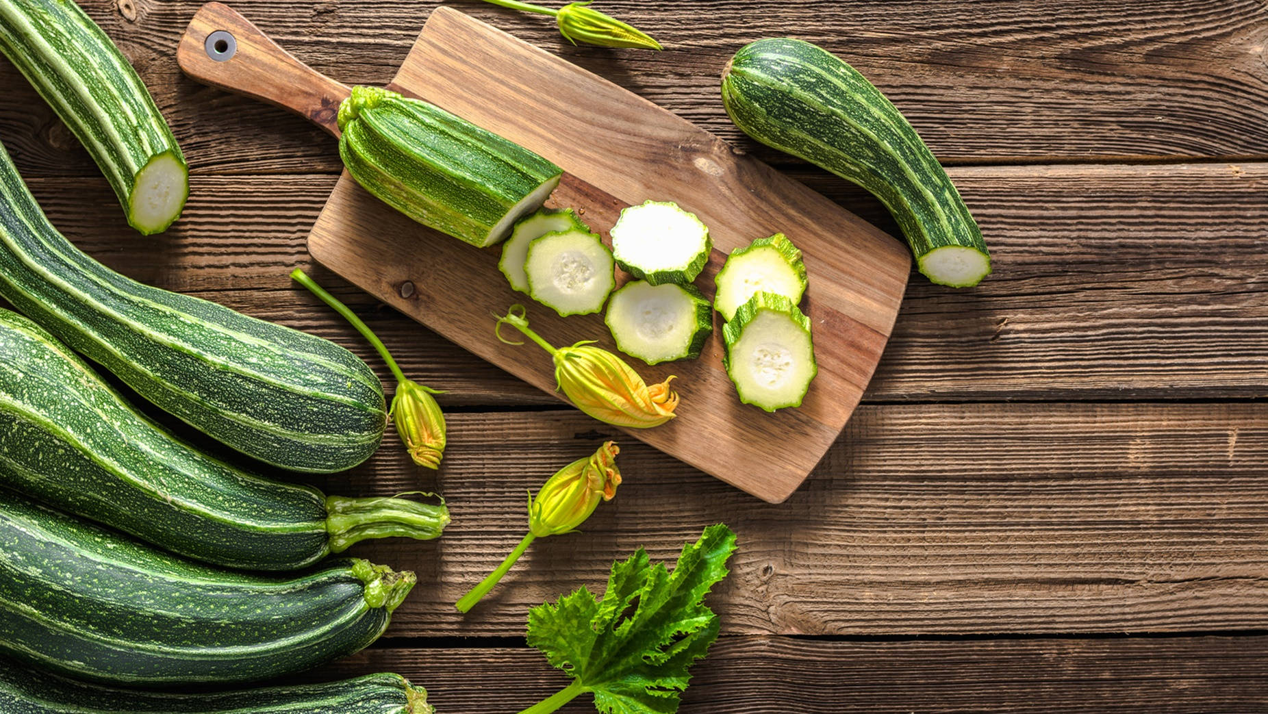 Zucchinis With Yellow Flowers Background